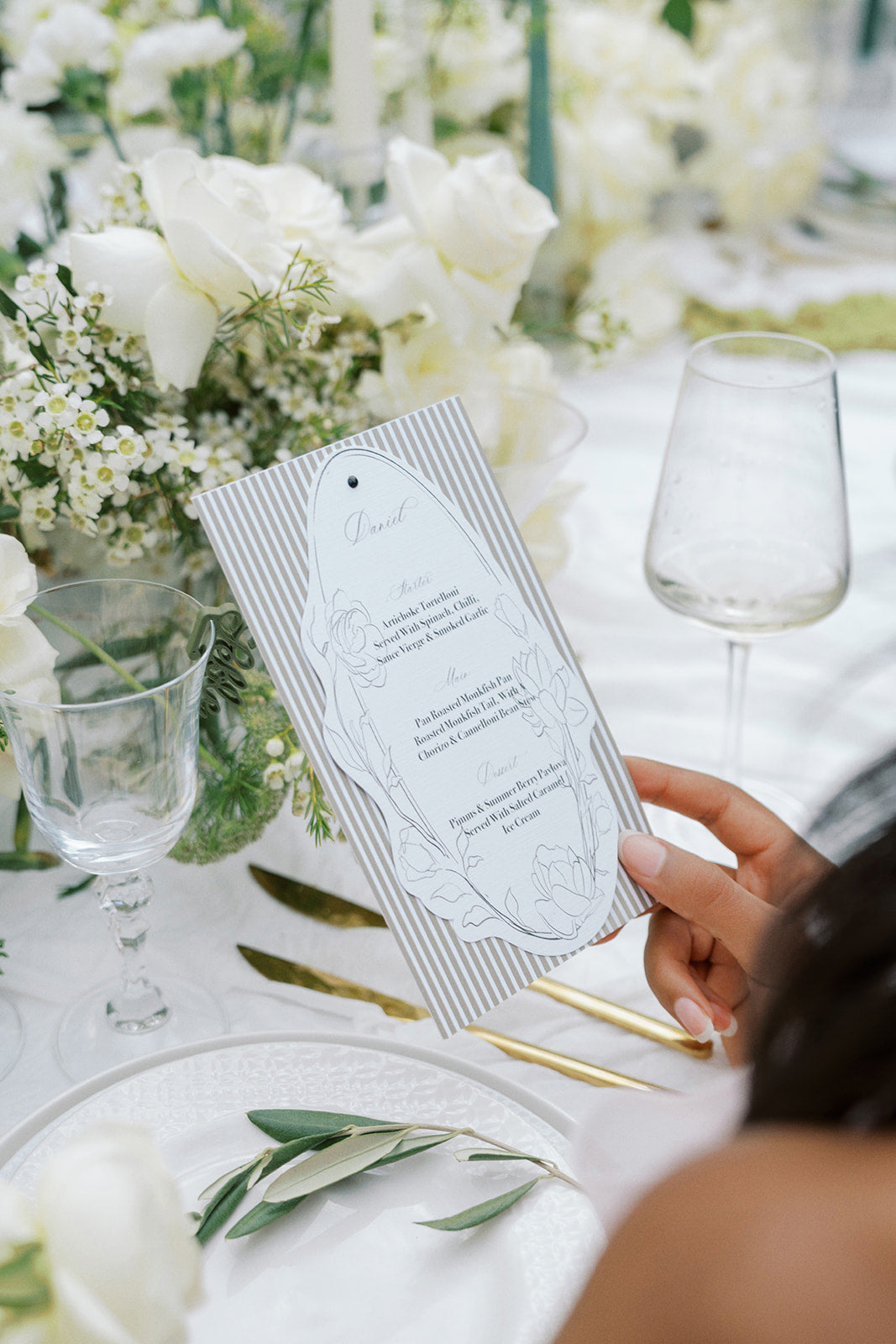 On the day wedding stationery styled at a reception table